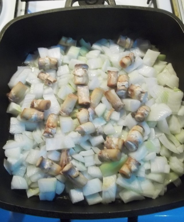 Frying Mushroom Stalks and chopped Onions