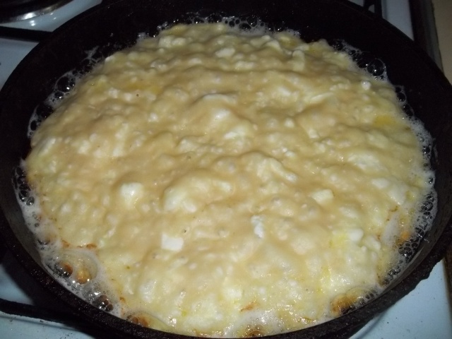 Khachapuri dough and cheese mixture in pan