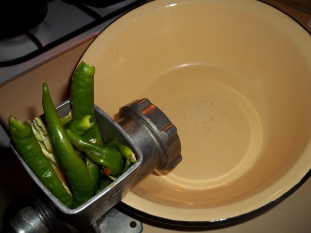 Grinding Green Peppers for Green Ajika Recipe