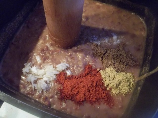 Adding Spices and Garlic to Lobio with Corn Recipe