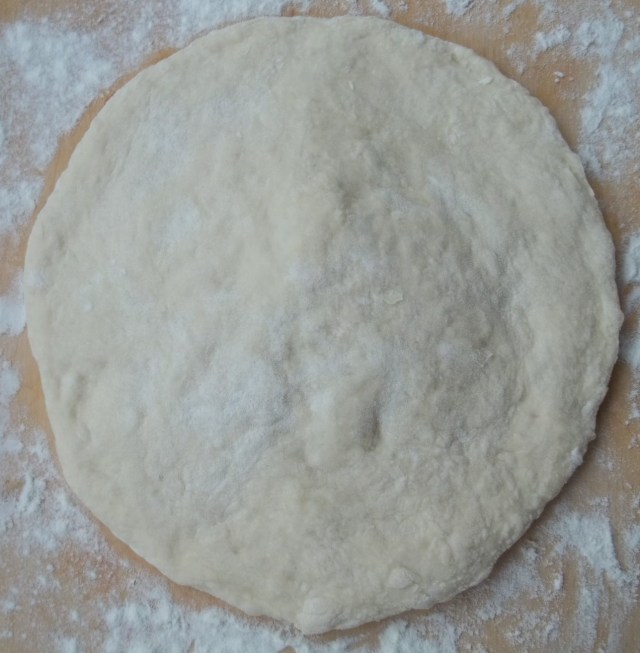 flattening-the-dough-for-khachapuri-with-potato-recipe